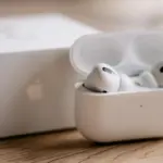 white apple earpods in white plastic case