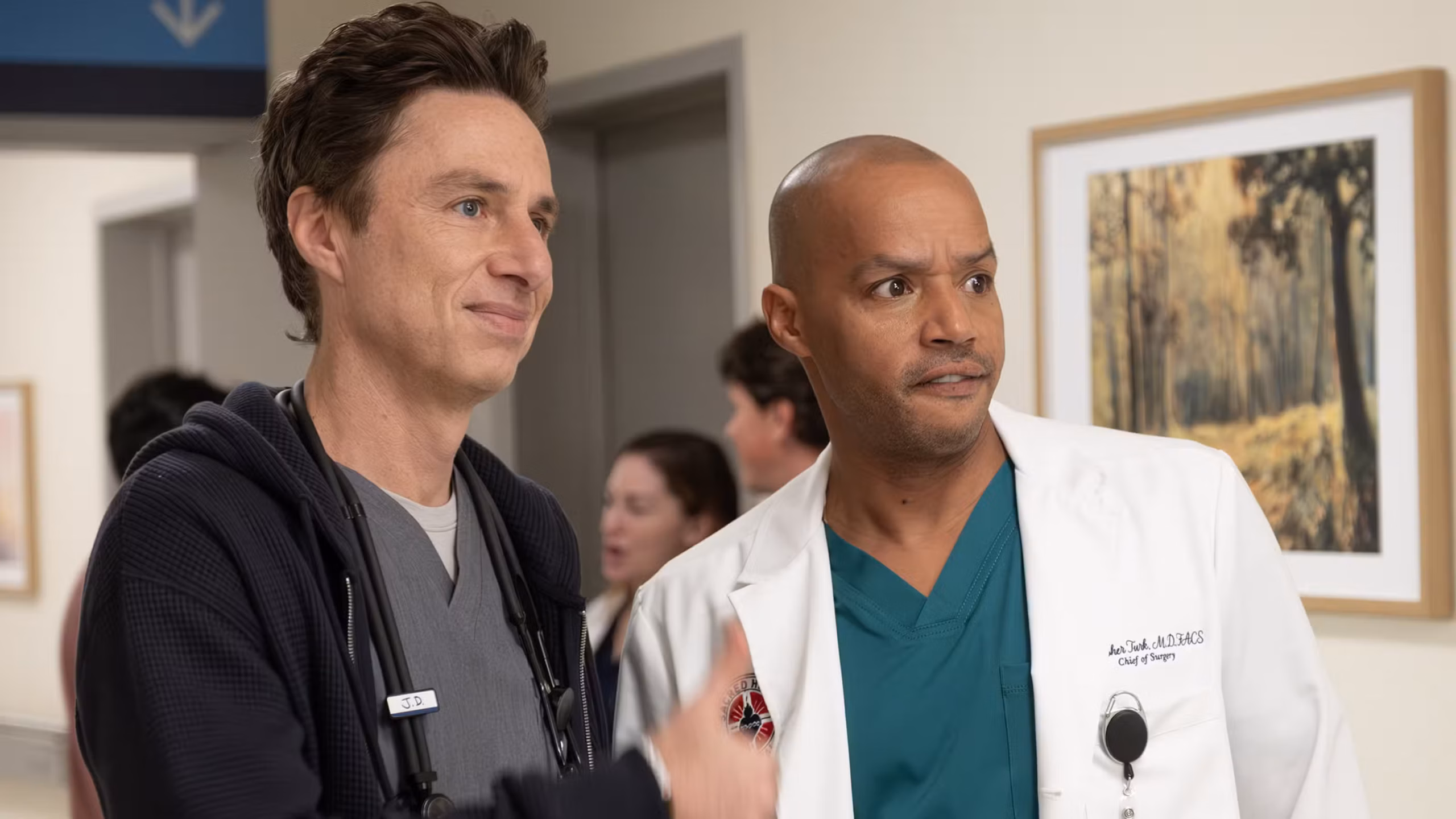 Jd and turk standing together in the scrubs revival